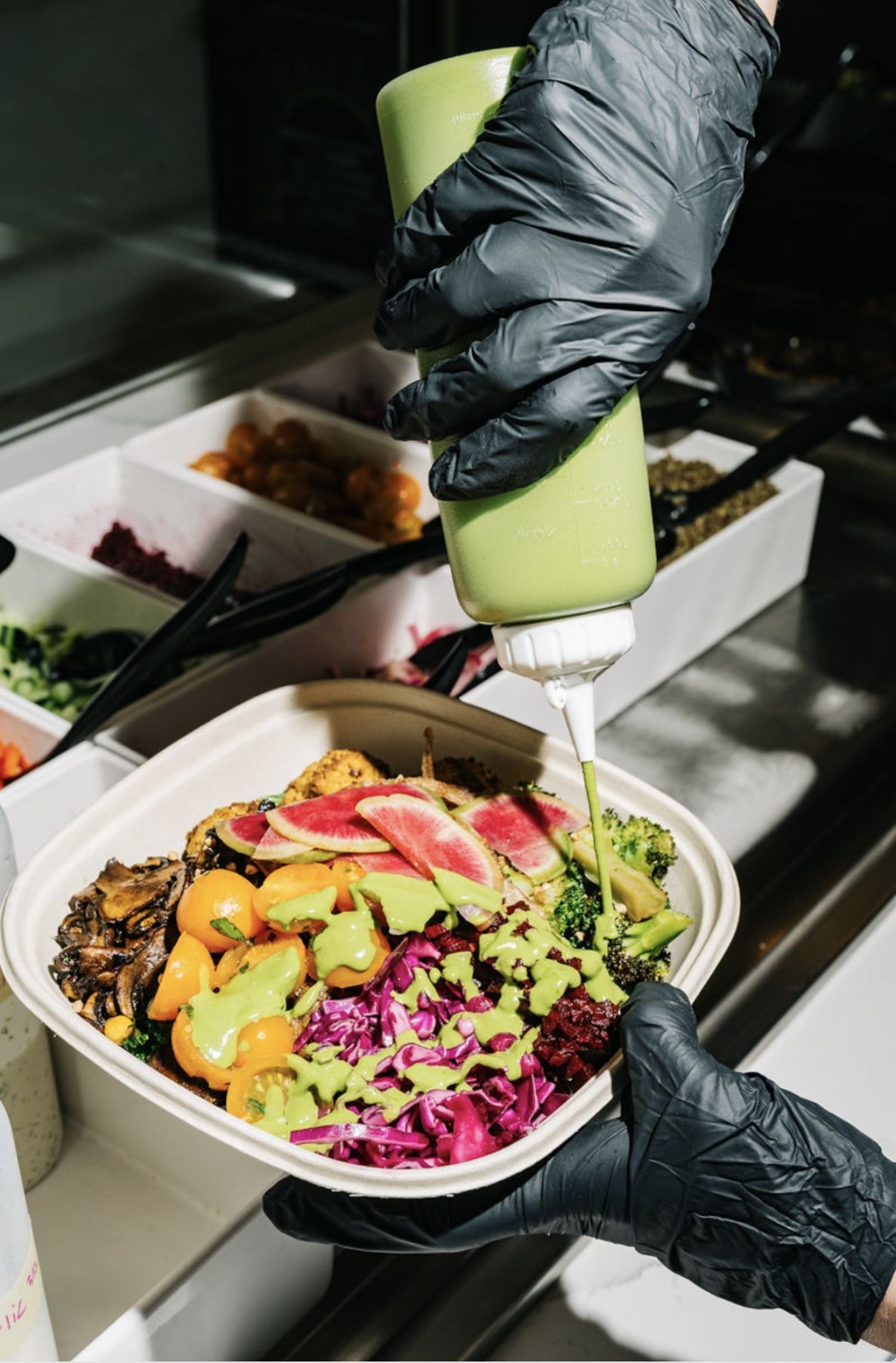 Fresh Maisongreen bowl being dressed